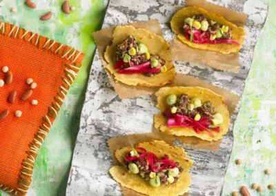 Pinta bean tacos with pickled onion and guacamole