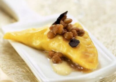 Lentil ravioli with leek cream and truffle